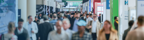 Picture of an exhibition hall with many visitors