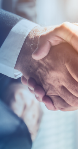 two businessmen shake hands