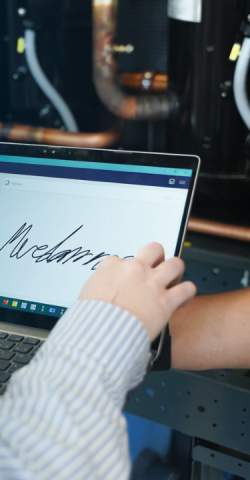 Customer signs service order on a tablet